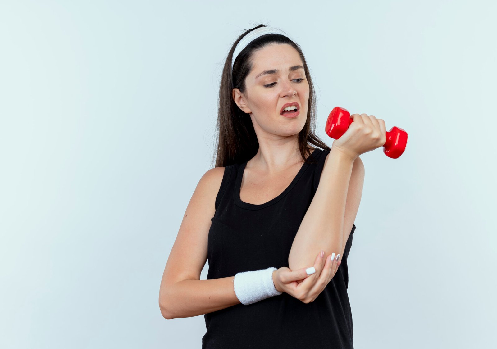 Woman training with a dumbbell